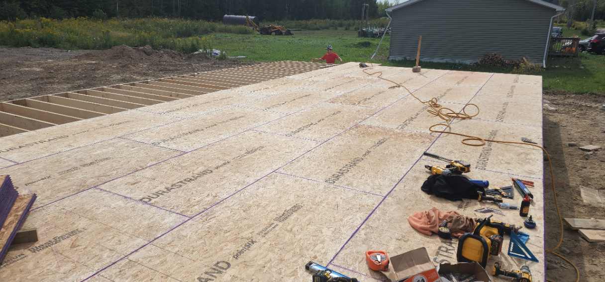 Structural framing on reinforced slab foundation